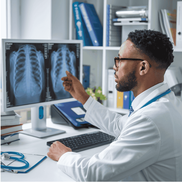 Pulmonologist reviewing chest X-rays for a pulmonology expert witness case analysis from a home office.